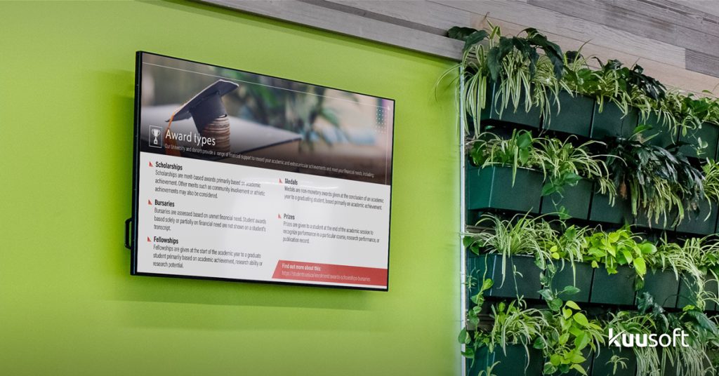 education digital signage in hallway showing school announcement