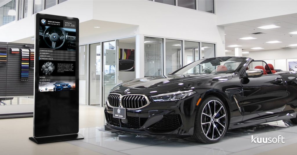 car dealership signage kiosk in show room lobby